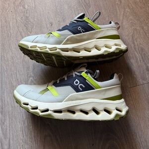 On Running Sneakers with Green and Blue Accents